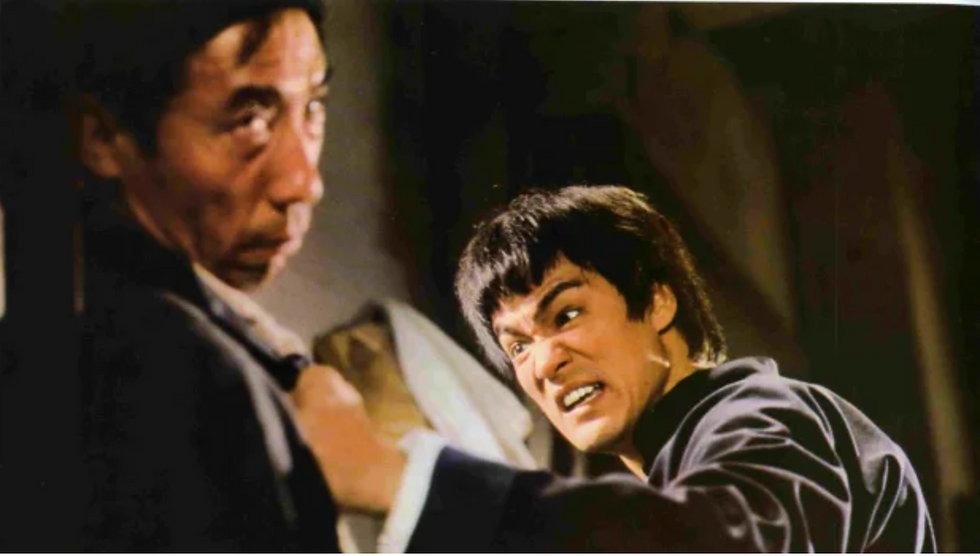 bruce lee hitting someone in fist of fury