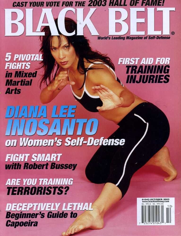 Woman in a martial arts pose on "Black Belt" magazine cover, October 2003. Text highlights self-defense and training articles.