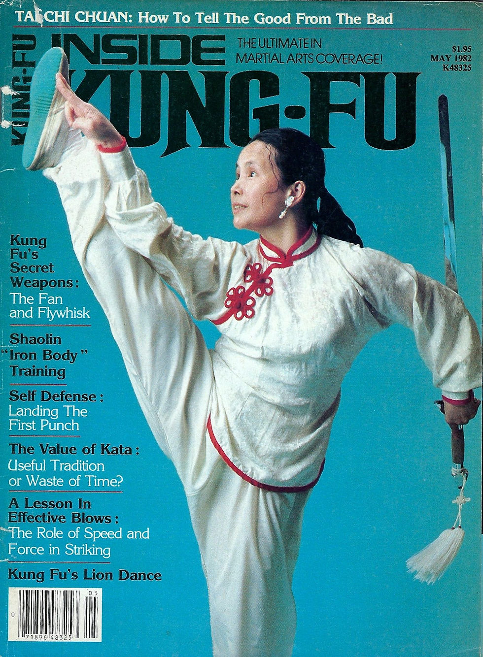 Martial artist in white attire performing high kick, holding a sword, on magazine cover. Blue background with text on Kung Fu topics.