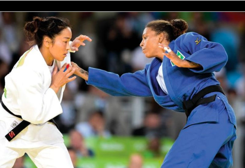 Two judoka face against each other