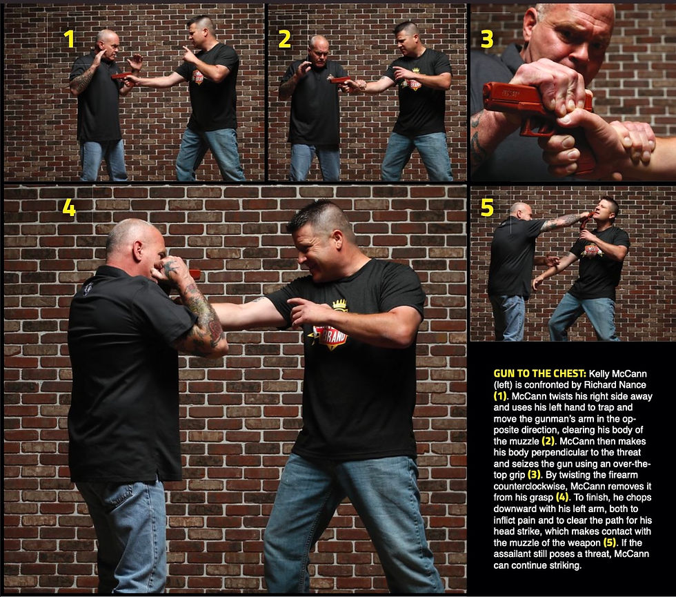 Two men demonstrating a gun disarm defense against a brick wall. One uses hand techniques to twist, trap, and counter the opponent's aim.