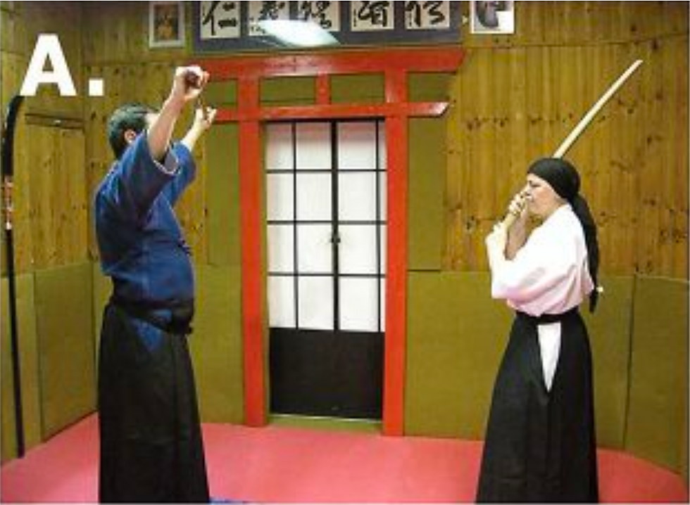 A. The jo practitioner stands with his feet together, his weapon horizontal and overhead. The opponent is ready to advance.
