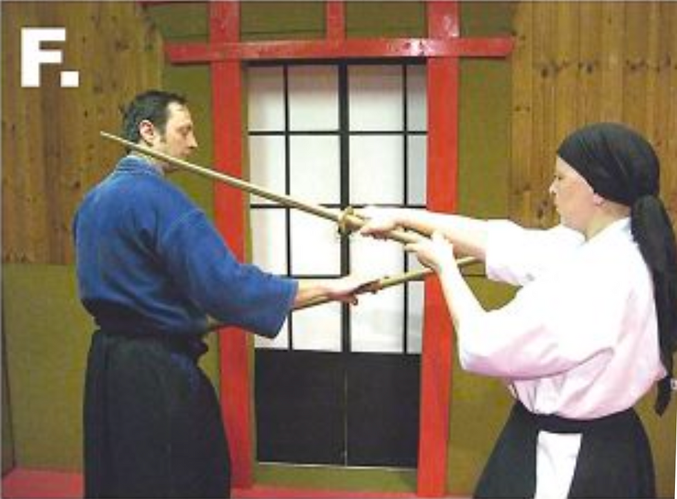 F. The opponent steps backward with her left foot, envisioning the completion of this cut.