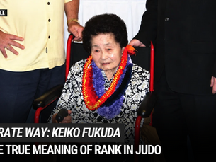 an elderly woman sits in a wheelchair escorted by two men