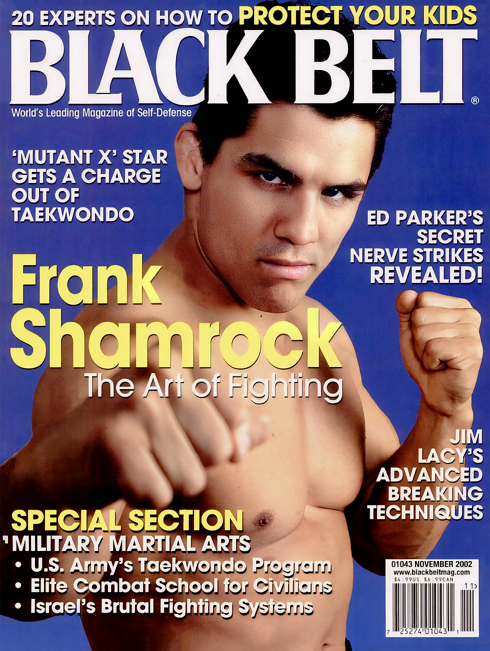 Black Belt magazine cover with Frank Shamrock in fighting pose, fists raised on blue background, bold text and headlines.