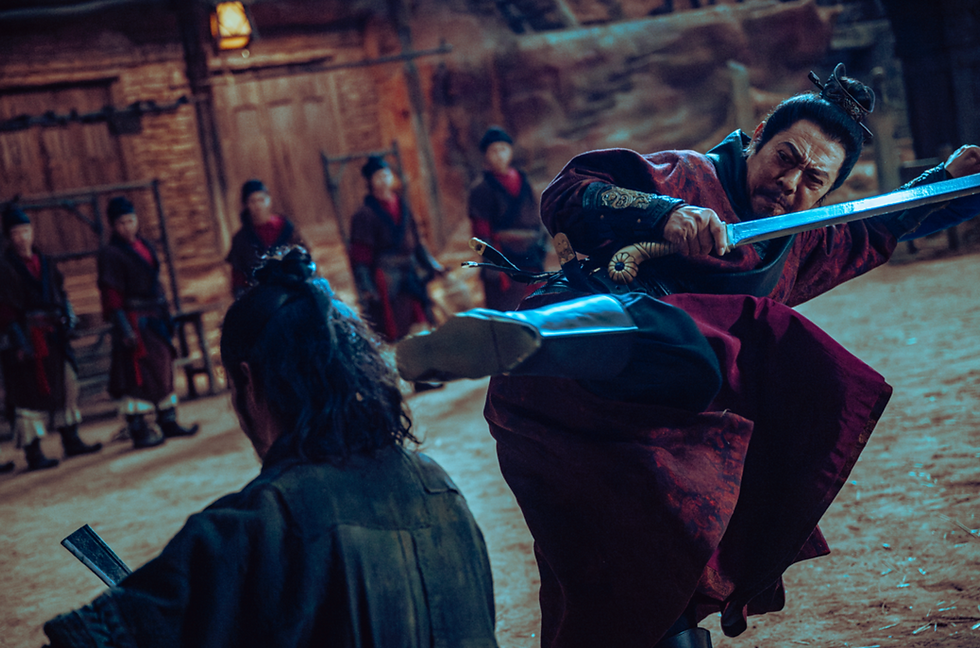 Armored samurai in red strikes with a sword in a courtyard, facing a crouched opponent; tense, dramatic duel scene.