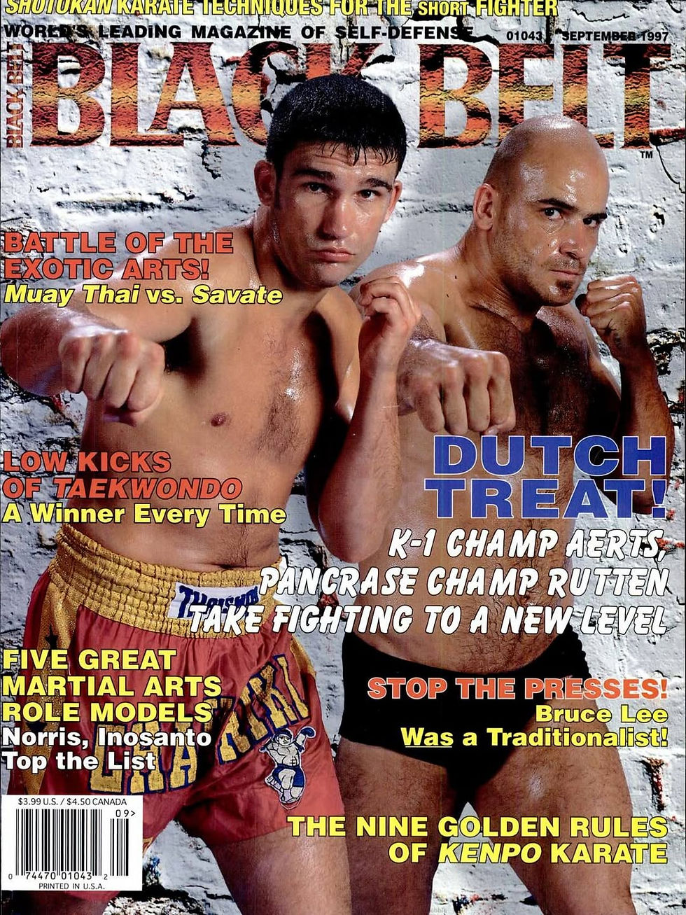 Martial arts magazine cover with two shirtless fighters in guard poses before a white brick wall, bold headlines and September 1997 text.