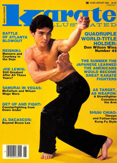 Shirtless martial artist poses on yellow Karate Illustrated magazine cover with blue cover lines.