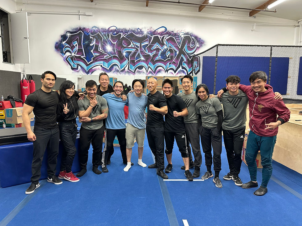 The stunt team stand posed for a group picture