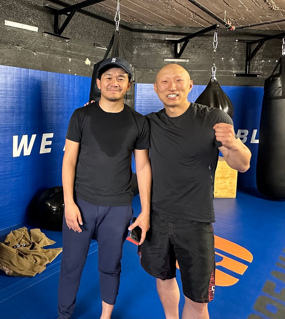 Arnold Chon poses for a picture after training
